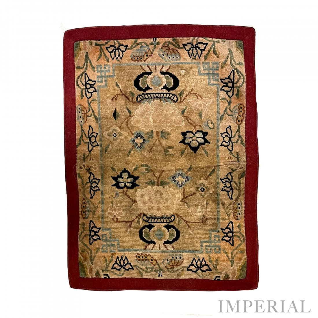 AN UPPER SADDLE RUG, TIBET, 1920s: An upper saddle rug, Tibet, 1920s. Decorated with floral designs on an ivory ground. 67.5cm x 52.5cm.