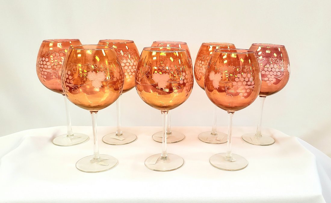 8 large Portuguese Wine Goblets: Vintage set of 8 large wine goblets in orange opalescent, edged with grape leaves and grapes. Dimensions: 9.25" H x 4.25" W.