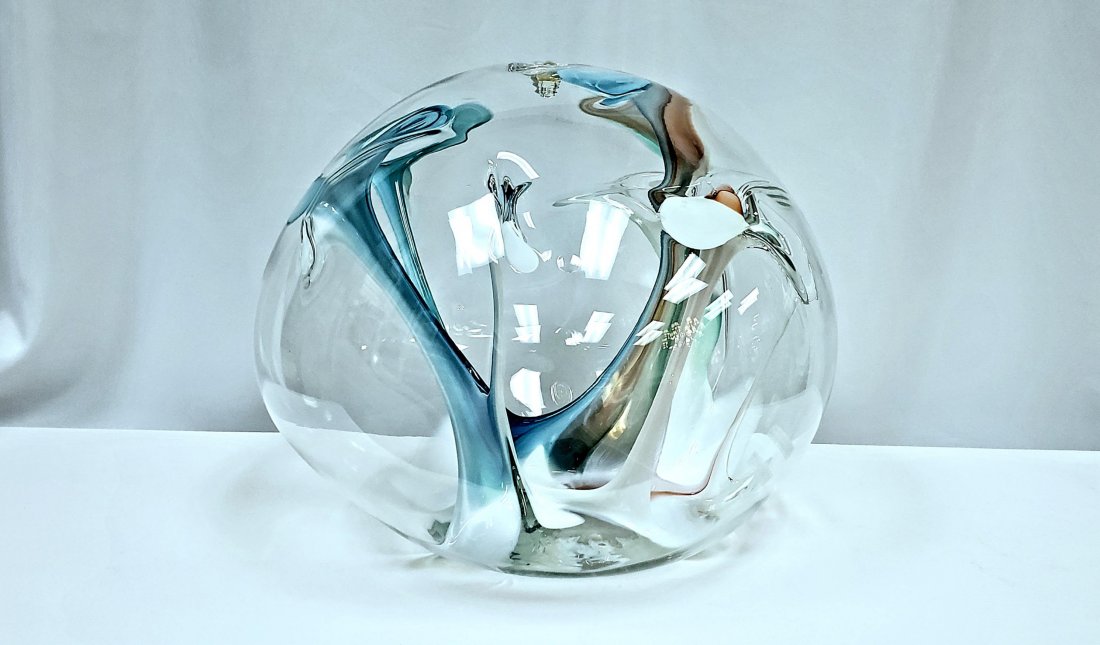 "Ocean Sunset," Peter Bramhall Art Glass Sculpture: Marvelous Peter Bramhall (American, b.1942) handblown studio art glass orb. Serene freeform interior elements evoke blues of the ocean and oranges of the sunset. Signed and dated etched on the undersi