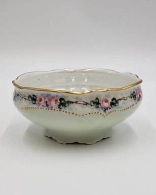 Oscar And Edgar Gutherz Royal Austria Antique Bowl: Delicate antique fine porcelain bowl by Oscar and Edgar Gutherz of Royal Austria is circled in sweet pink roses above a dotted gold border. The scalloped rim is trimmed in gold. Hand-signed, "Leonard"