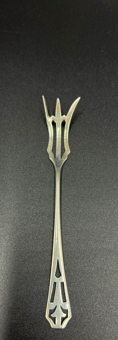 Webster Sterling Silver Pierced Lemon Fork: Sterling silver lemon fork made by Webster Silver Company. Early 20th Century American. Dimensions: 5"L