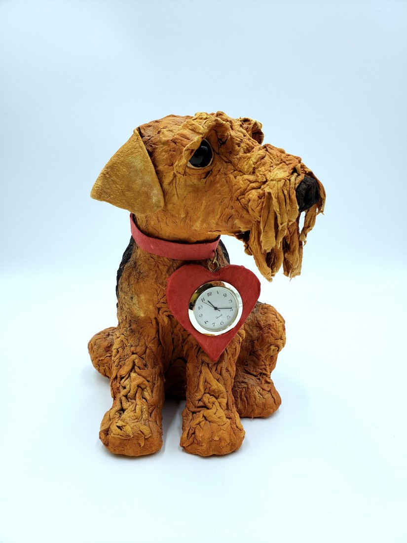 Seated Papier Mache Airedale Figurine With Clock Collar: Seated Papier Mache Airedale Figurine with batterie-operated heart-shaped clock collar. DIMENSIONS/inch: 6.50 W x 8.18 H x 10.50 D