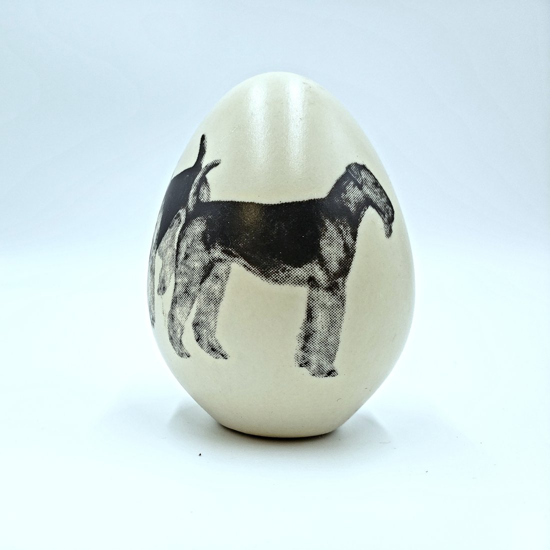 Airedale Hand-Crafted Porcelain Egg: Airedale Hand-Crafted Porcelain Egg. Made by Eggzakly Collectibles, USA. DIMENSIONS/inch: 2.50 W x 3.58 H x 2.50 D