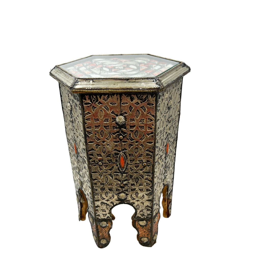 Moroccan-Style Hexagon-shaped Side Table: Petite Moroccan-style hexagon-shaped accent table. The table is adorned with stamped metal sheeting, colored bone inlay, and copper accents. The table's top features an inset piece of glass. DIMENSION