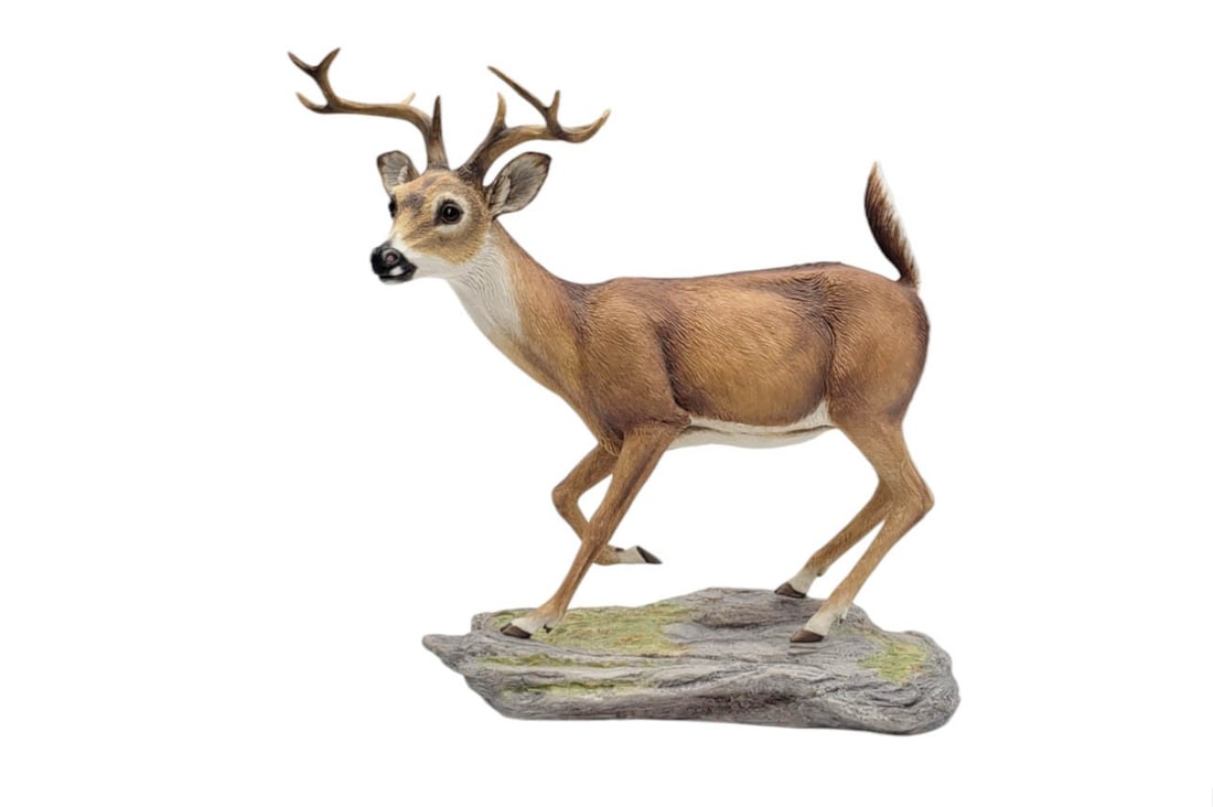 White Tailed Buck Porcelain Figurine by Boehm, England: A collectible Edward Boehm porcelain White Tailed Buck figurine. No. 71, limited series, model 50026. Made in England, 1984. Dimensions: 14" H x 13" W x 7" D