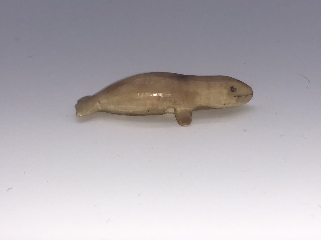 Late 19th Century Native Inuit Carved Whale Fetish Effigy: Late 19th Century Native Inuit Carved Whale Fetish Effigy Toggle. Excellent antique condition. See pictures for details as part of description. Approximate Measures: 1.75” long; 0.41” high
