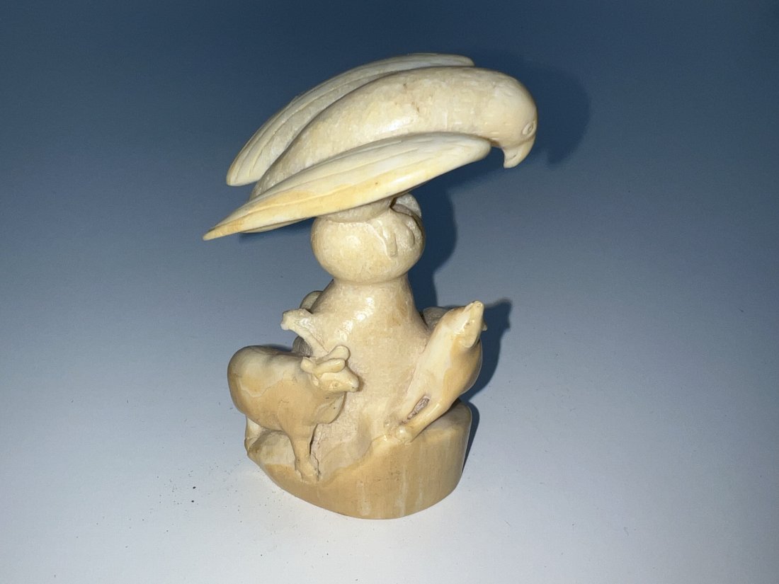 Mid Century Inuit Genuine Carved Whale Tooth Of Bird Wolf and Caribou: Looks like part of caribou antler is missing. See pictures for details as part of description. Measures 3.87” high x 2.24 inches long x 1.67” deep.