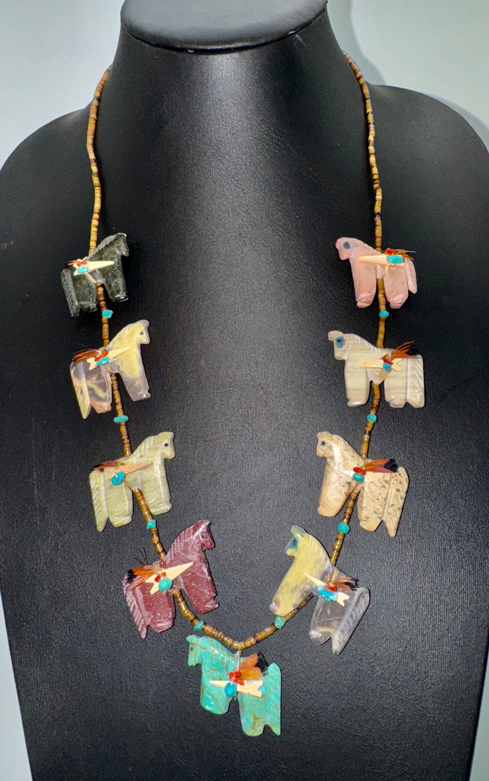 Navajo Carved Horse Fetish Necklace by Ron Upshaw: 1990's Native American Navajo carved stone horse fetish necklace by deceased artist, Ron Upshaw with sterling cones and traditional hook and loop closure.Weighs heavy 94 grams with a total length of 2