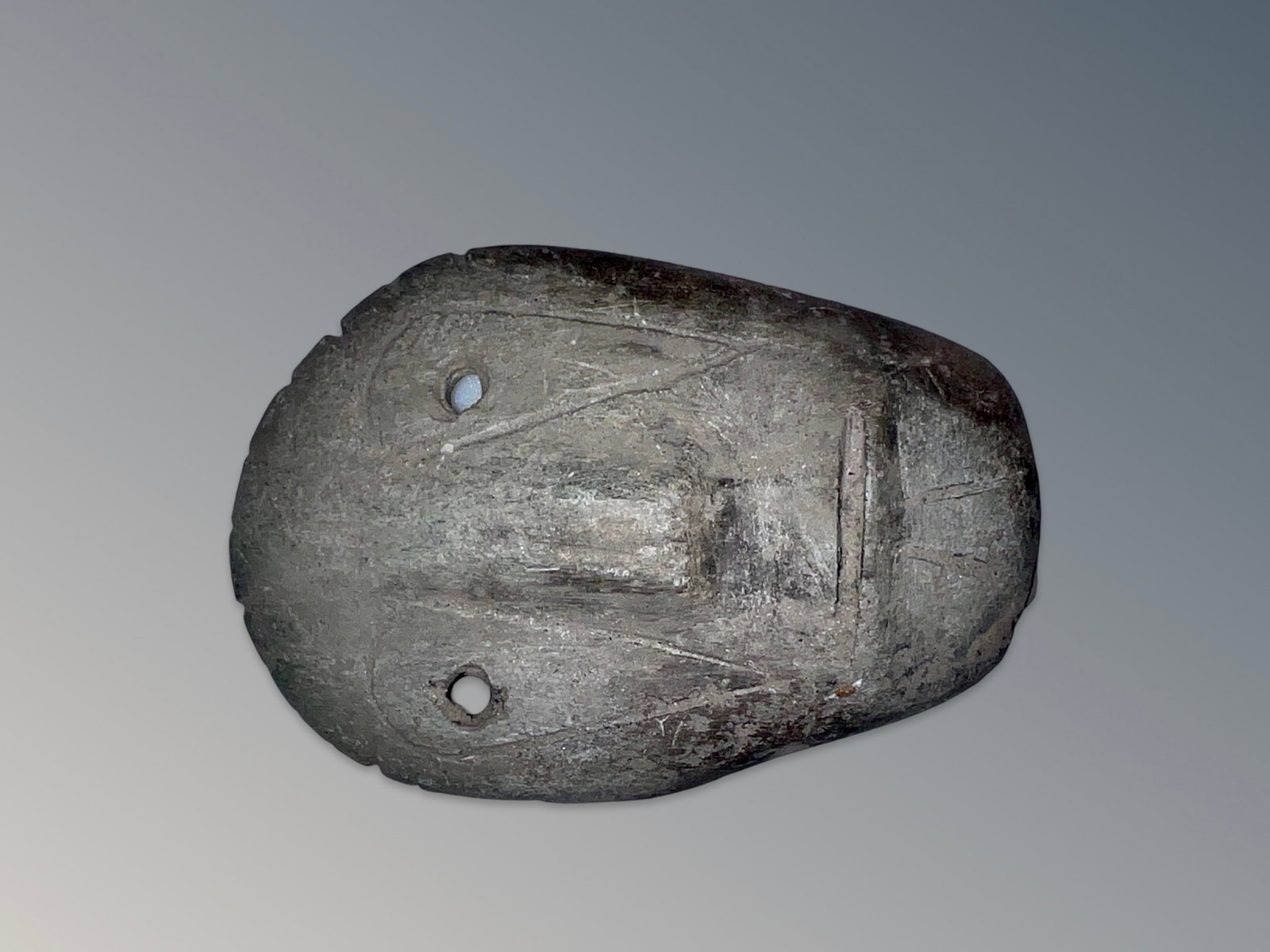 Native Carved Stone Weeping Eye Amulet: Native Carved Stone Weeping Eye Amulet. Has couple of nicks on edges and around eyes as expected. Measures approximately 4.24 inches long X 3 inches wide X 0.8 inches deep.