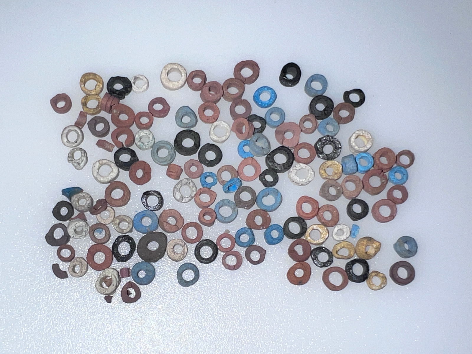 100+ New Kingdom Egyptian Faience Beads: 100+ New Kingdom, 1315-1060 B.C. and later. Decorated with a variety of colored glazes and including a broad range of bead types. Range typically from 3.5mm to 6mm. Ex Palm Beac Collector Estate.