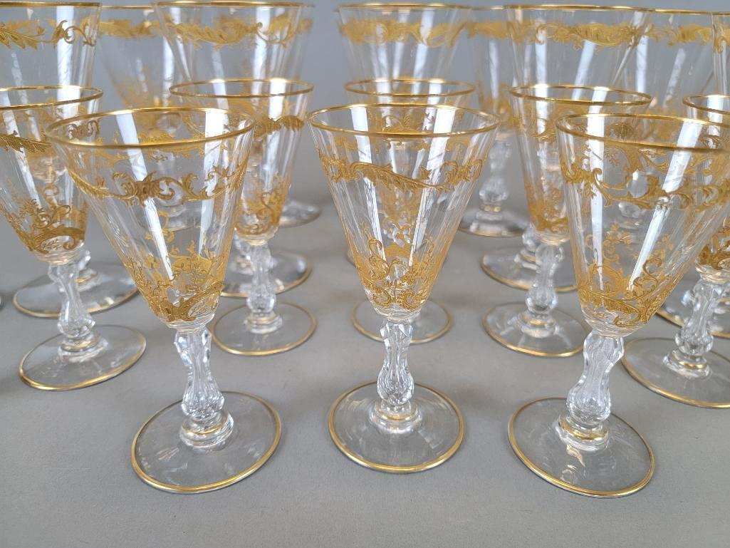 Group Antique St. Louis Micado Crystal Stemware: Group to include ten hand-blown crystal water goblets and twelve white wine glasses, Micado pattern for St. Louis Glass & Crystal; each with etched floral scrolled gilding, zipper cut stems, ray cut b