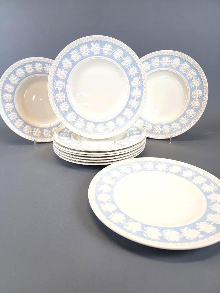 10 Wedgewood Wellesley Blue & Ivory Porcelain Dinner Plates: Ten (10) 10.75" dinner plates in the Wellesley pattern for Wedgewood, with edges slightly raised boasting decorative borders and repeating clusters of fruit w/ foliage in ivory and pale blue; each