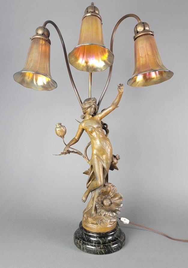 Antique Whimsical French Art Nouveau Spelter Figural Lamp, Nude Woman: The form cast in patinated spelter representing a semi-nude draped female figure highlighted with accents of poppy flowers in the art nouveau 'belle epoque' style, surmounts a marble base and 