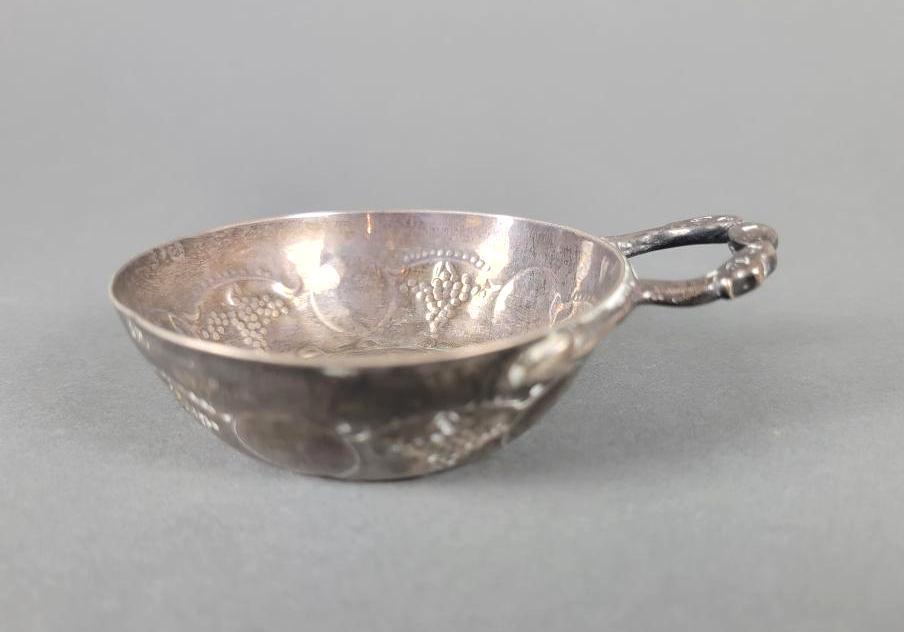 Antique French Sterling Silver Tastevin Wine Cup, Marc Parrod: The cup and handle form presented in the manner of the Ancien Regime, hand forged with impressed motifs, rim with incised text 'Bardon & Gevrey, 1741', with hallmark to Marc Parrod, Dijon,