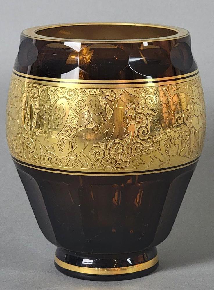 Antique VTG Bohemian Czech MOSER Art Deco Amber Glass Vase, Greco-Roman: The tapered vase form with faceted panels in a rich amber hue, features a gilded acid etched 'oroplastic' frieze with Greco-Roman nude female figures and warriors over a scrolled field, rests 