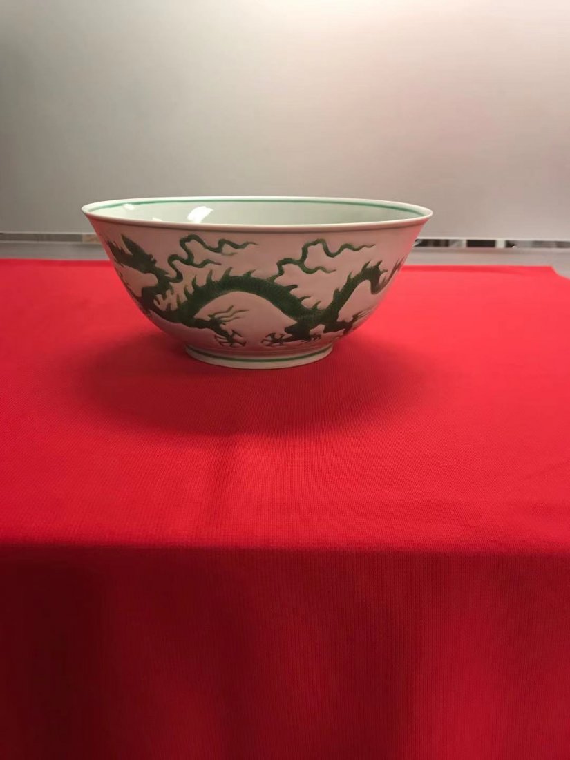 A Chinese green on white porcelain bowl: Chinese green on white porcelain bowl with dragon, Ming Zhengde period, R F A Riesco mark,size H:3in W:8.5in, good condition!