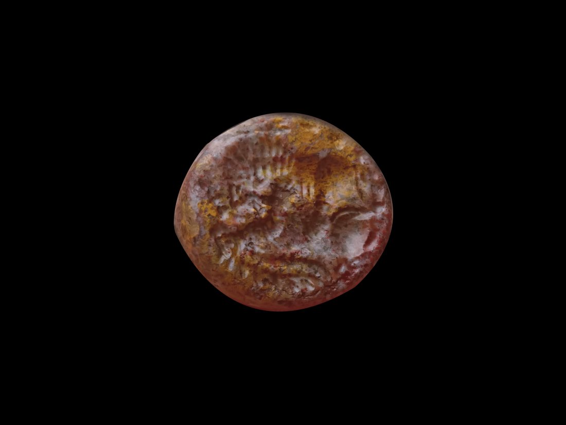 Sasanian Mottled Jasper Domed Seal with Lion Hunting: A Sasanian mottled jasper domed seal with lion hunting scene. Sasanian Persian, 224 - 651 CE. Dimension: 2x1.7cm. The seal is made of red jasper mottled with yellow and white. On its truncated surface