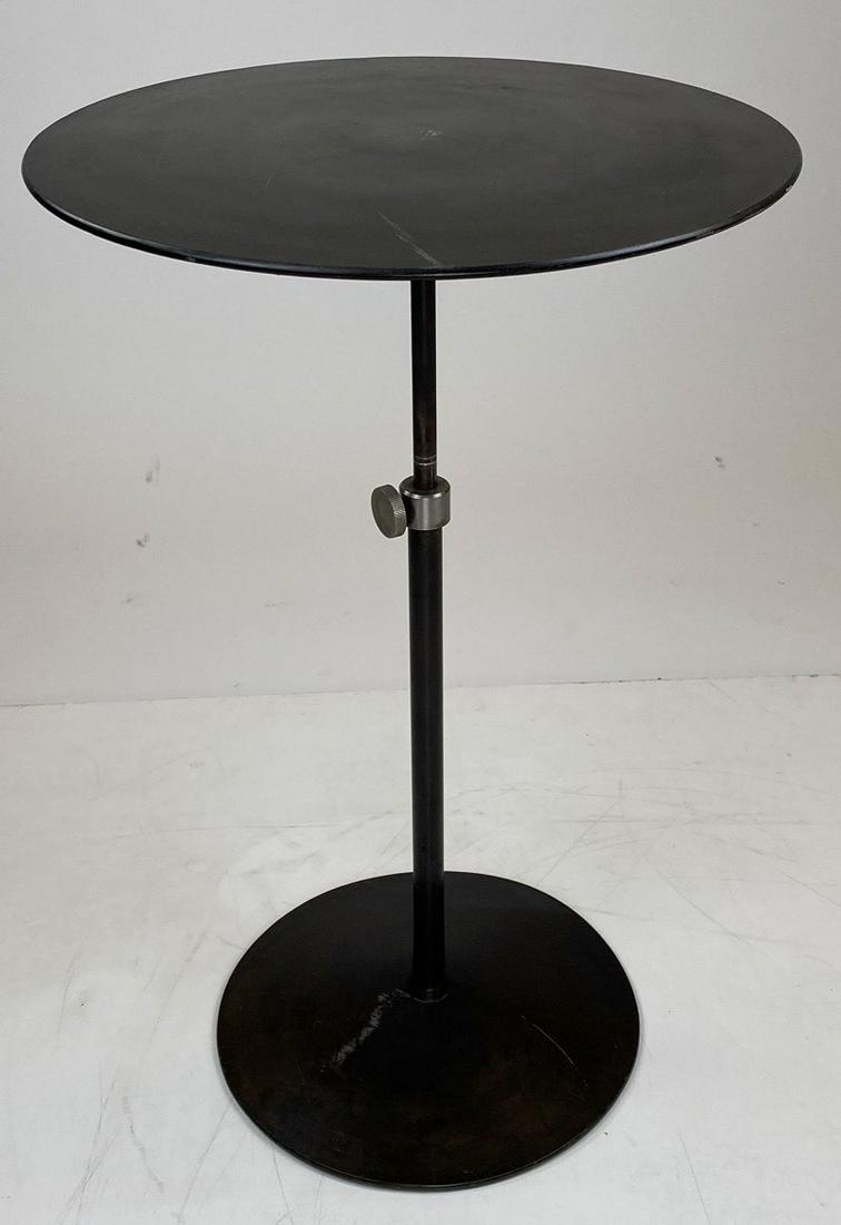 Mid Century Jos Metal Side Table: Adjustable height, this metal side table has a turn knob release for height adjustment. Sturdy.