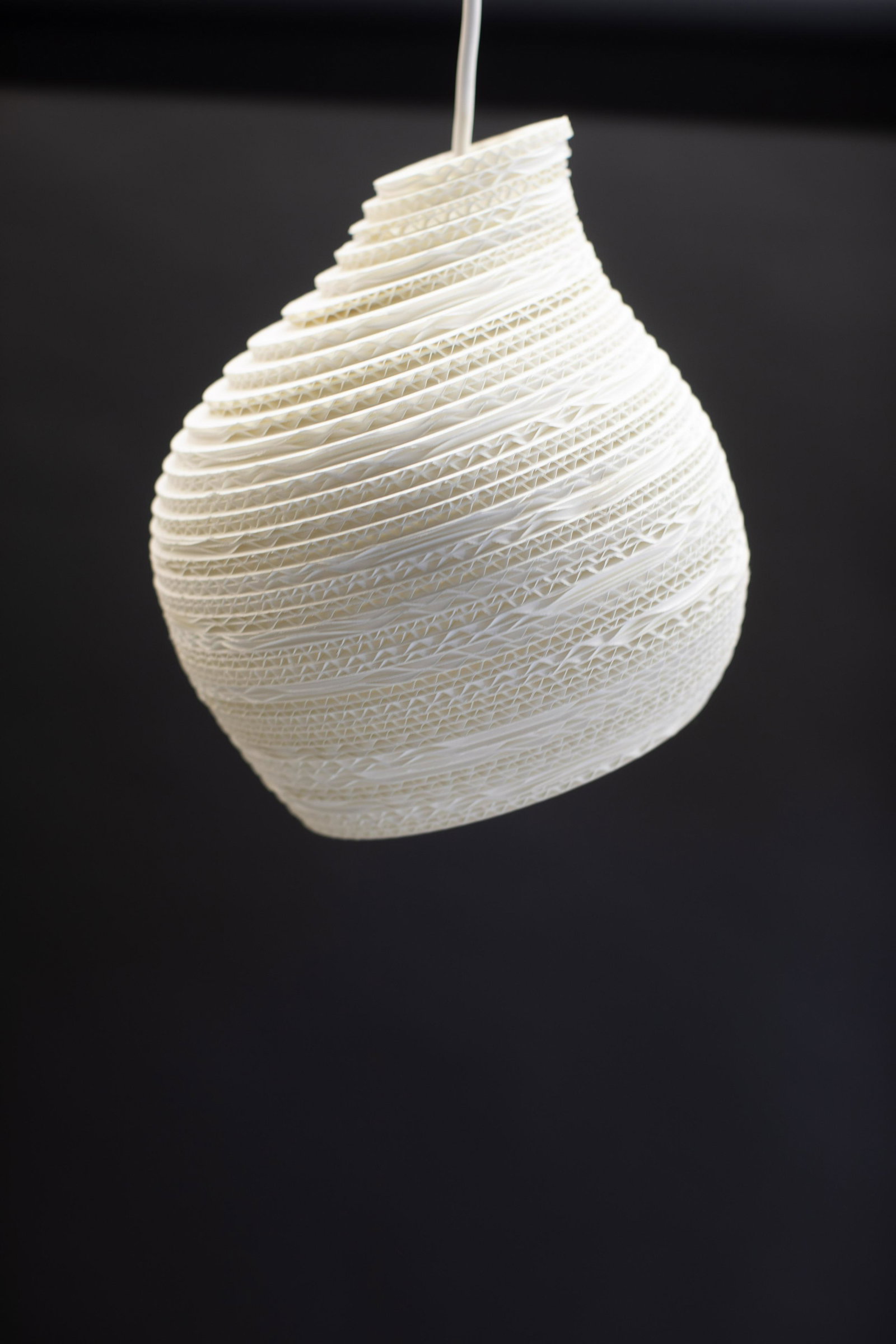 Large Hive Scraplight Pendant in White, By Greypants: The Hive Scraplight Pendant offers an organically shaped design that is handmade from re-purposed cardboard boxes and features a non-toxic fire retardant treatment. This is the largest of three Hive P