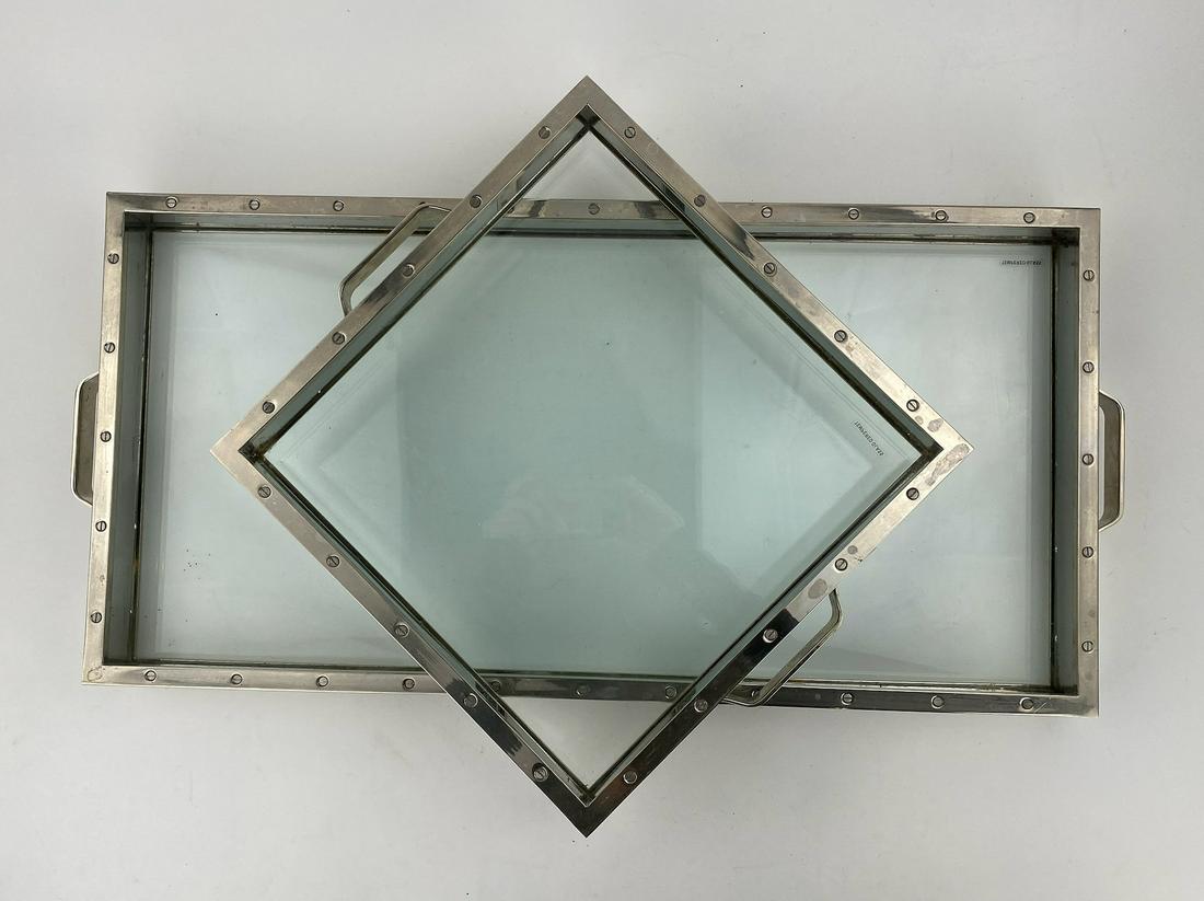 Two Chrome and Glass Bar or Table Top Trays: Heavy glass framed by chrome creates these nice bar or counter top trays. Nautical style.***Please note Pick ups for this Auction must be made or arranged for to be made by August 12th***