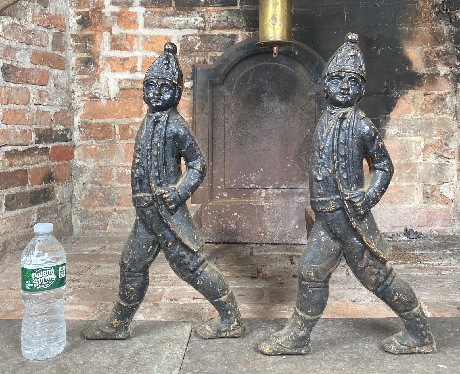 American Antique Hessian Statue Andirons: Beautiful antique 19th century American andirons. Depicting soldiers holding swords in hand and eagle on hat on the march. Heirloom quality and true Americana.