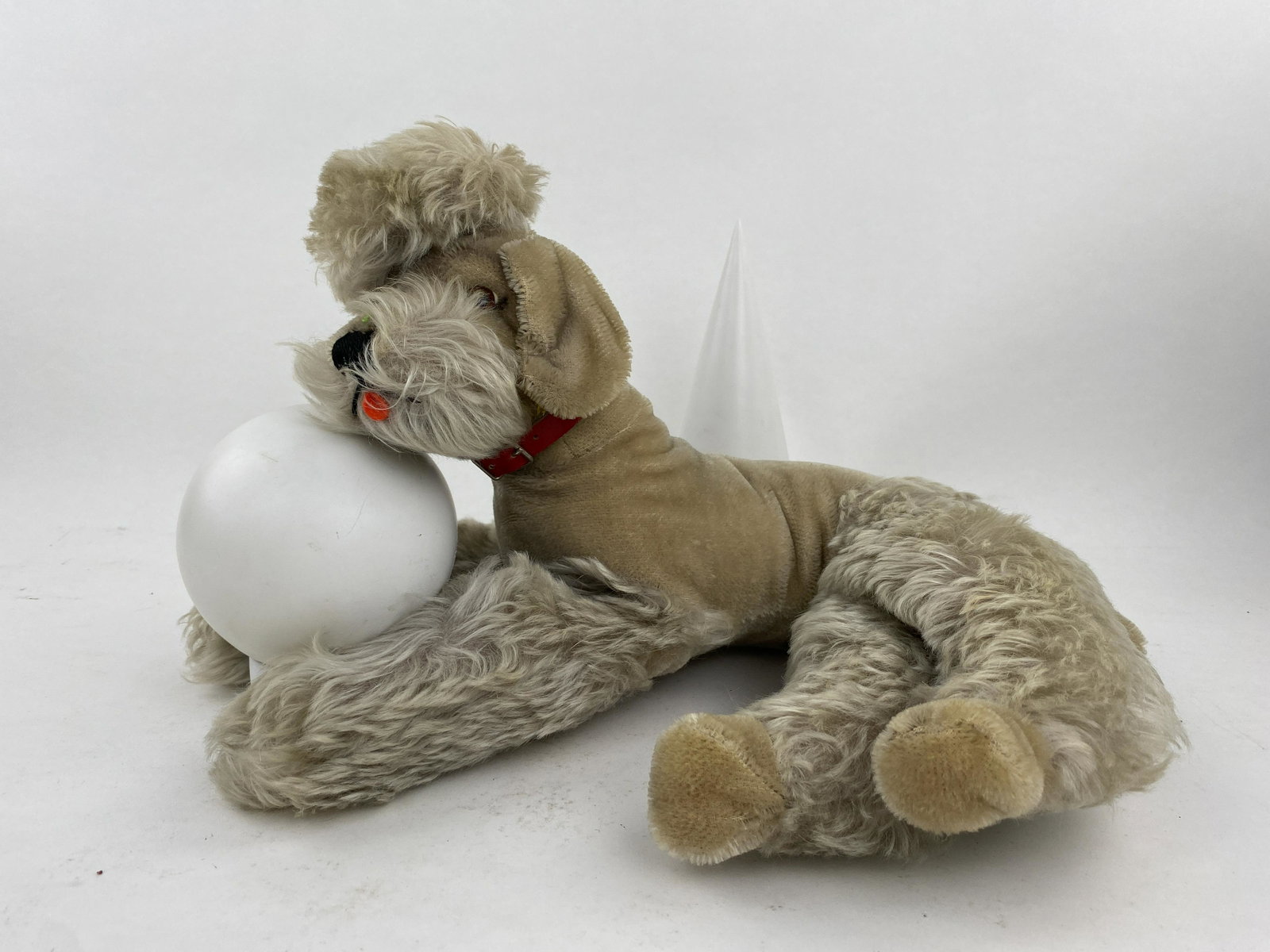 Steiff Vintage Medium Poodle: Fantastic vintage 1950s snobby poodle. Medium sized poodle in beige mohair and is straw filled. All four legs and head are jointed. Little red tongue with plastic black nose and brown plastic eyes