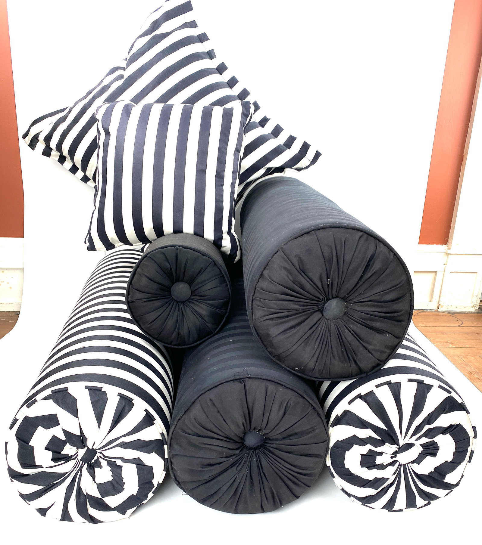 Bolster and Throw Pillows: Assortment black and white cabana stripe bolster pillows, throw pillows, and black on black striped pillows. Pillows measure 28x28 and 17x17, large bolsters have a diameter of 10.5 by 38 long, smaller