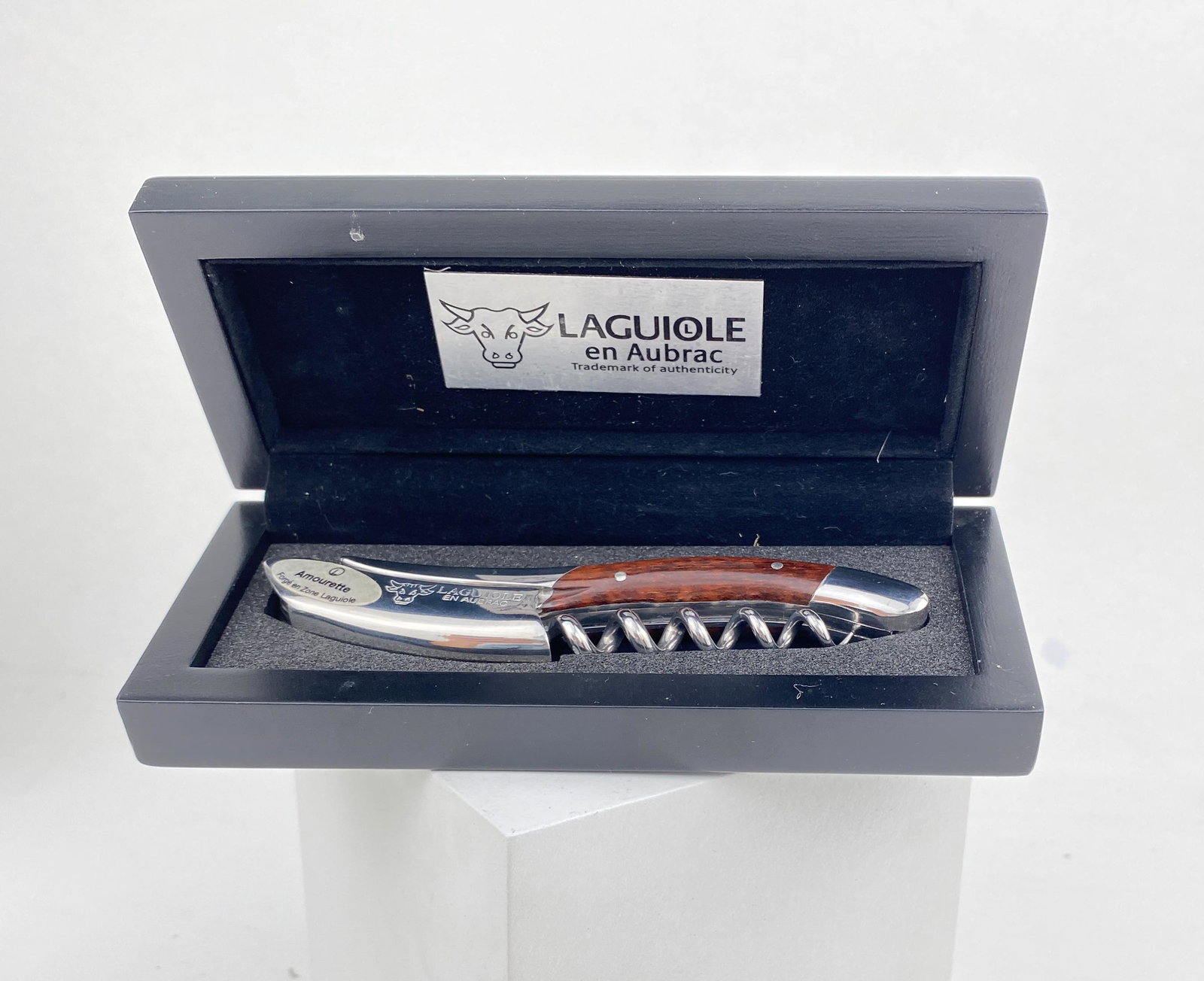 Laguiole French Corkscrew: Expertly crafted folding corkscrew and foil cutter. Handcrafted wood. Serrated foil cutter with built in bottle opener.