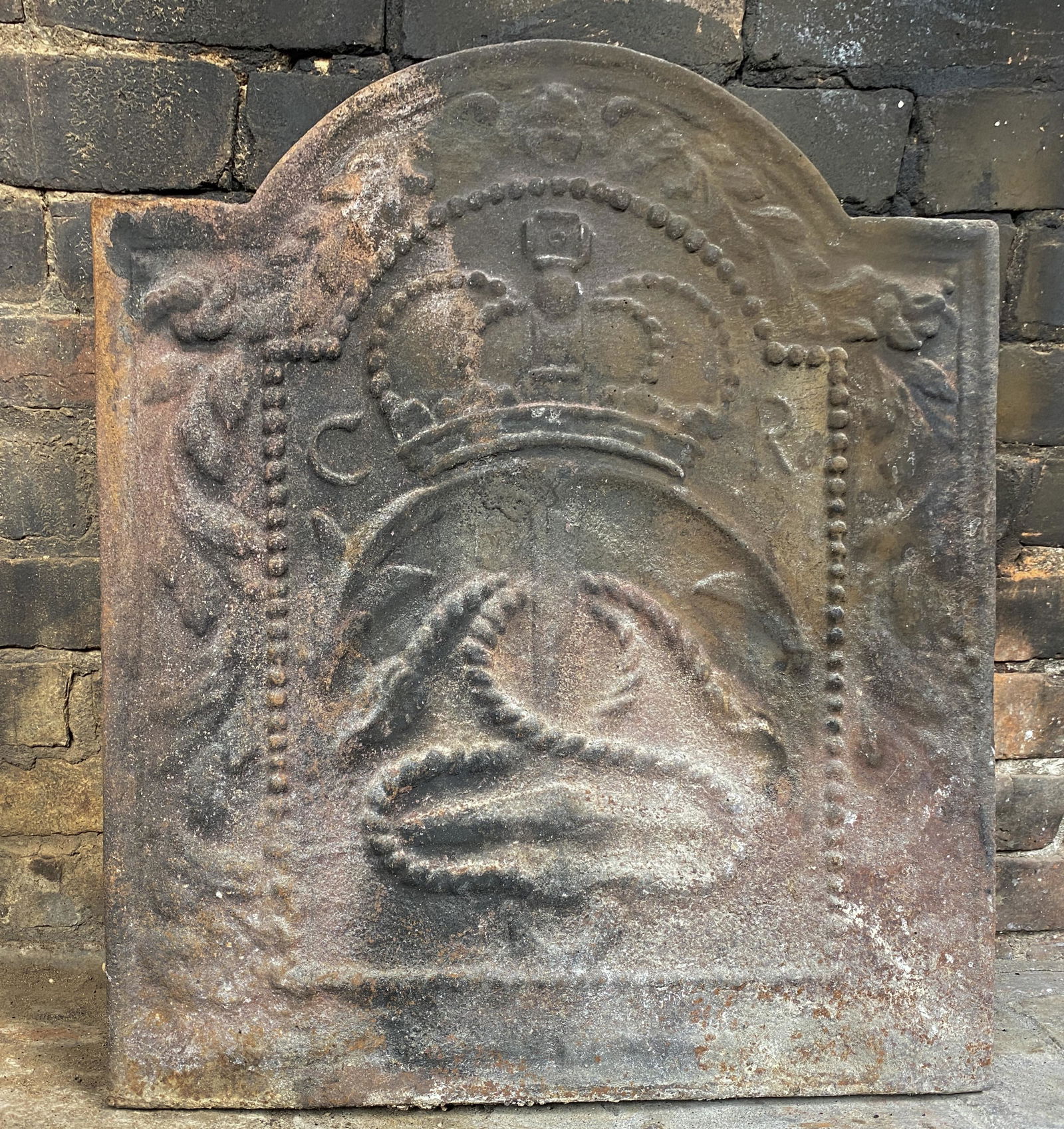 Antique Heraldic Cast Iron Fireback: Fantastic rare antique Heraldic cast iron fireback from France. Depicting hearth crown and serpent. Heraldic cast date back 500 years depicting a family's coat of arms at the center, and symbols in th