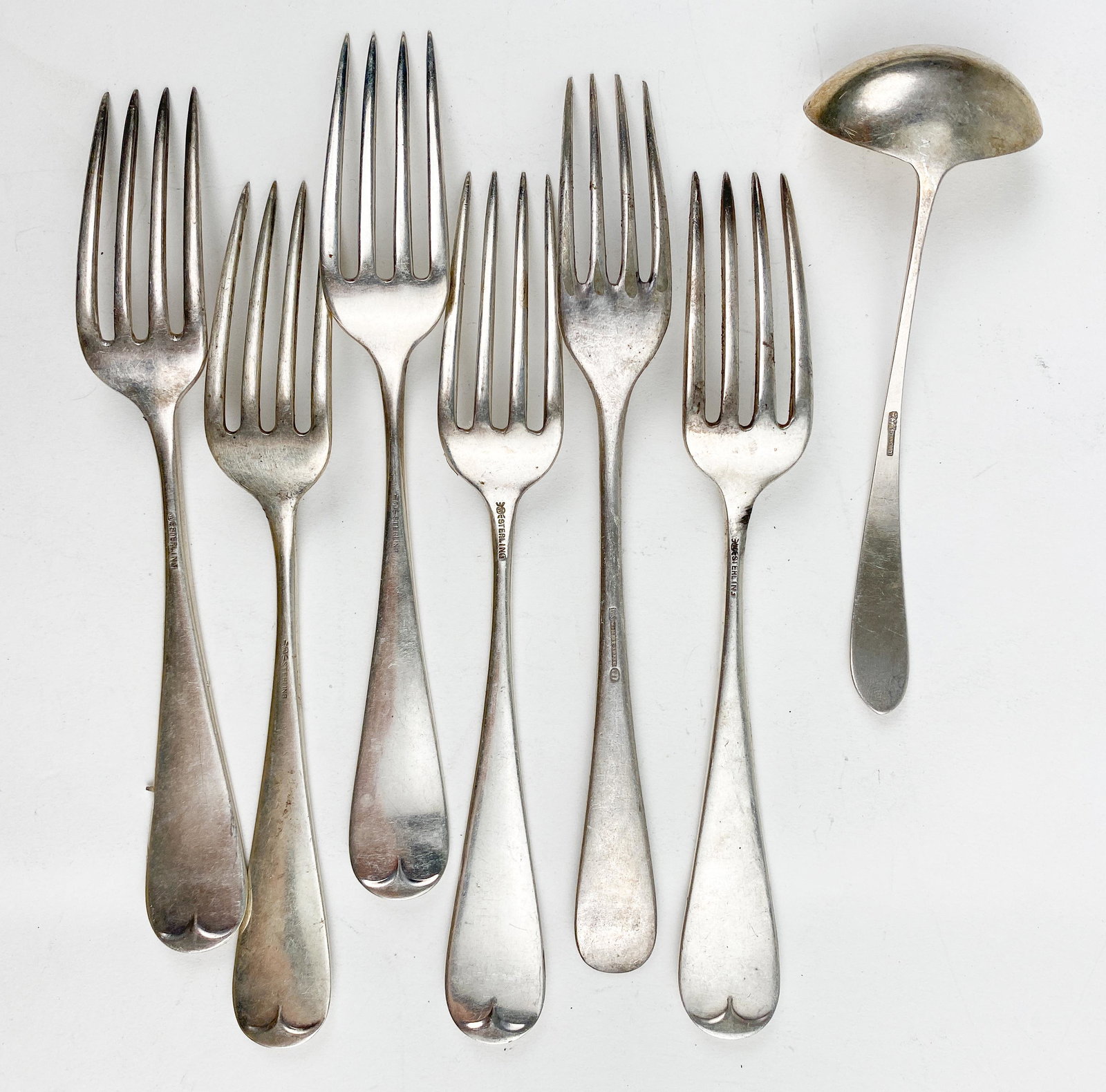 Wellner & Frank M. Whiting Co. Sterling Silver Salad Forks and a Gravy Ladle: 1 Wellner "aws silver" hallmark fork weighing 1.428 oZT / 44.42 g6 Frankn M. Whiting Co. Sterling Salad Forks weighing 8.064 oZT / 250.83 gSterling and Hallmarked Gravy Ladel measures 5 1/4" L x 1 3/4