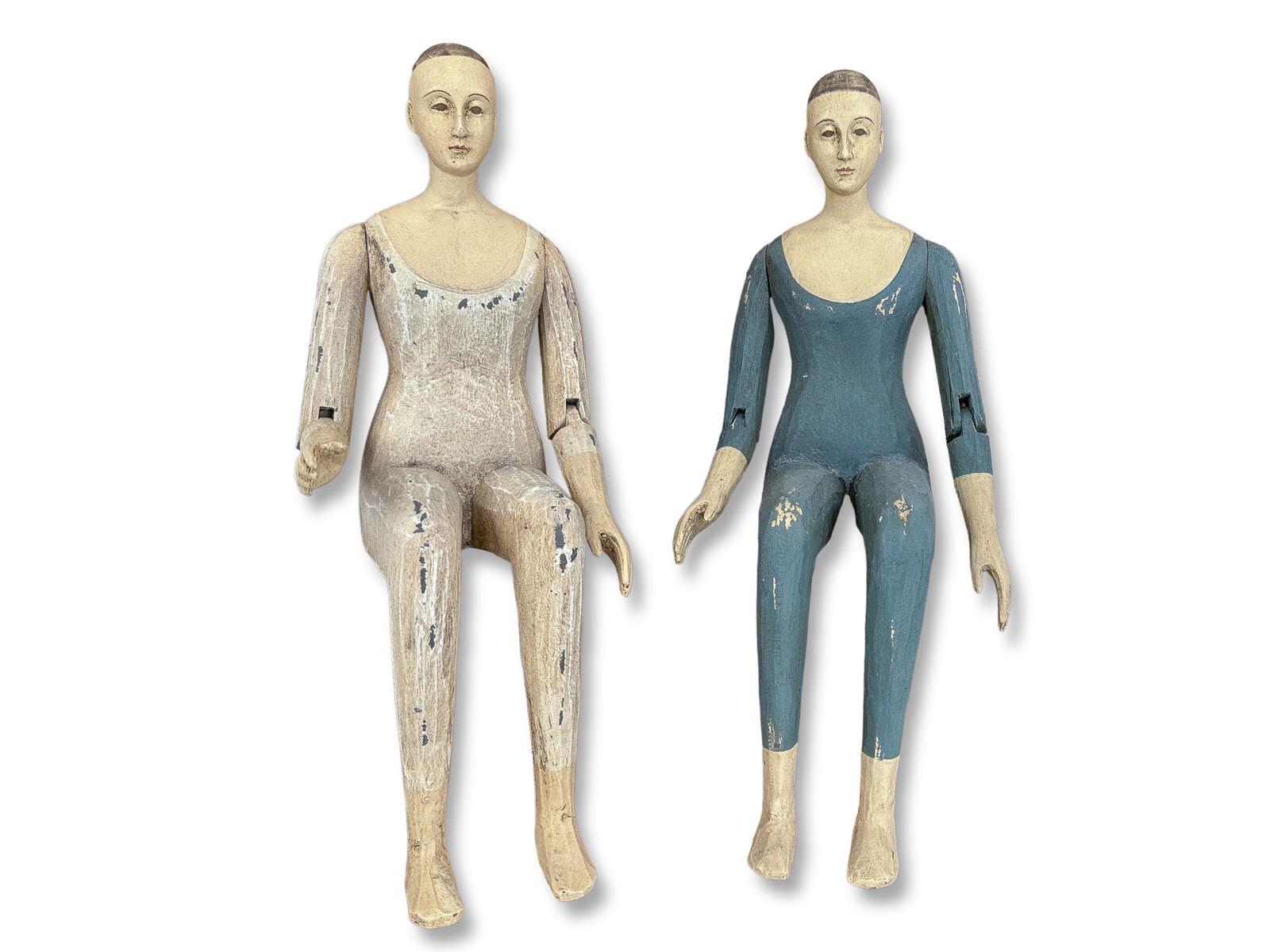 Two French Carved Wood Human Figures: Two wooden hinged arm, human figures in a French style. Fixed bent legs for shelf seating. Dimensions Width: 5" Depth: 5" Height: 11"