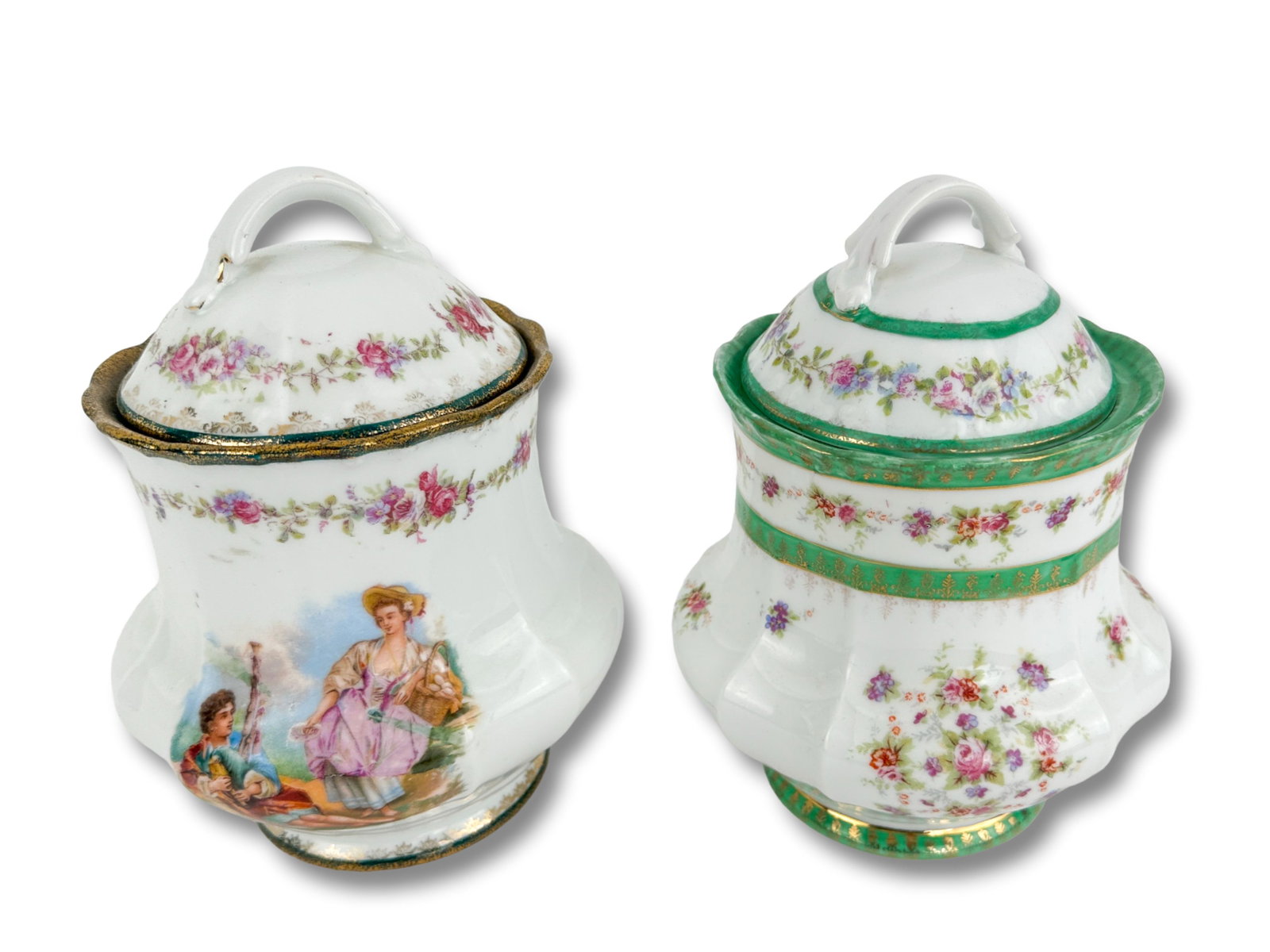 Two Antique Victoria Carlsbad Austria Biscuit Jars: Two Antique Victoria Carlsbad Austria Porcelain Biscuit jars with gilt and green hand painted glazing. Dimensions Width: 6" Depth:6" Height: 8"
