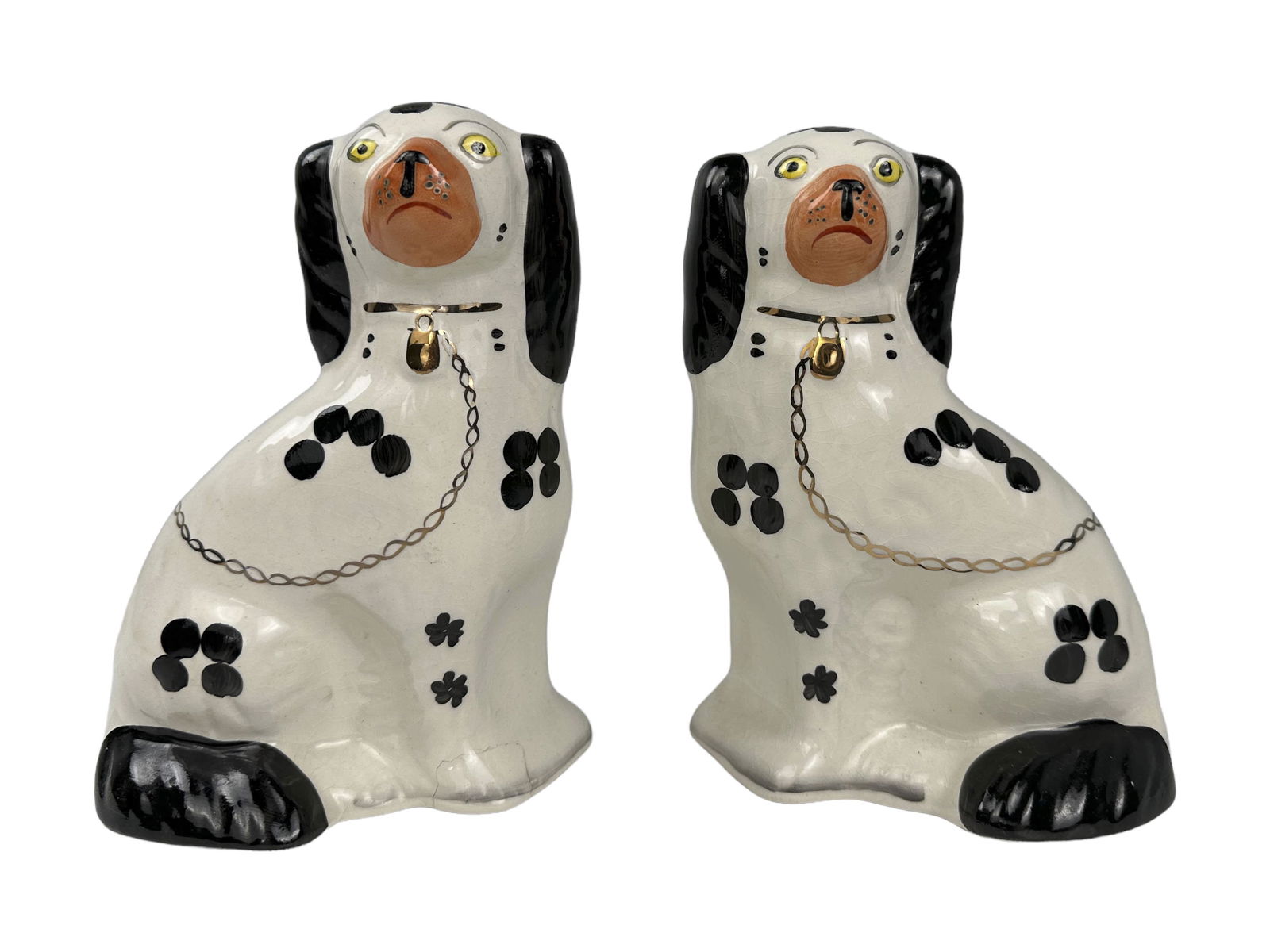House of Goebel Staffordshire Disraeli Spaniels: A pair of classic, seated Staffordshire â€œDisraeli” spaniels, hand-painted black and white with gold accents. Marked "House of Goebel Staffordshire England Arthur Wood England 4558" on unde