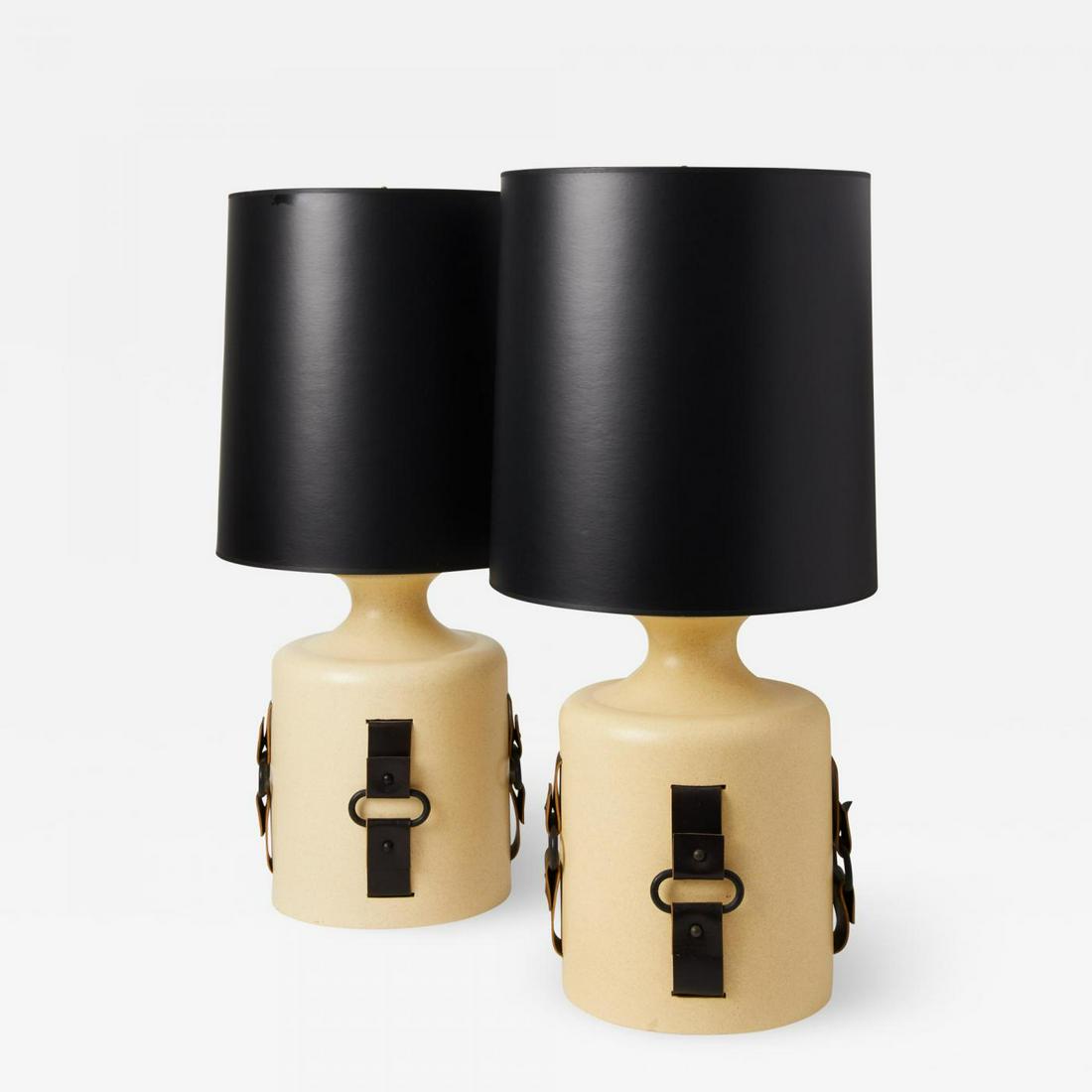 Pair of 1970's Earthenware and Leather Strap Lamps: Pair of 1970's oversized earthenware lamps with horse tack style buckle detail and black satin finish paper shades. Rewired with double sockets that allow for optimal light. Measures:H. 12 in; H.2. 33