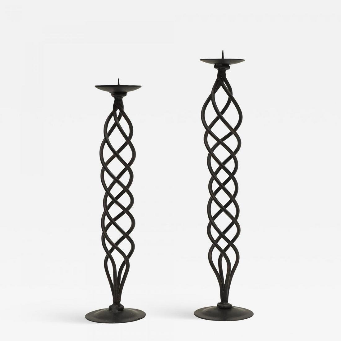 Quadruple Helix Candlesticks: Hand crafted in Mexico this elegant duo of quadruple helix candle sticks are striking in any environment. Measures:H. 18 in; H.2. 16 in; Diam. 4.5 in;