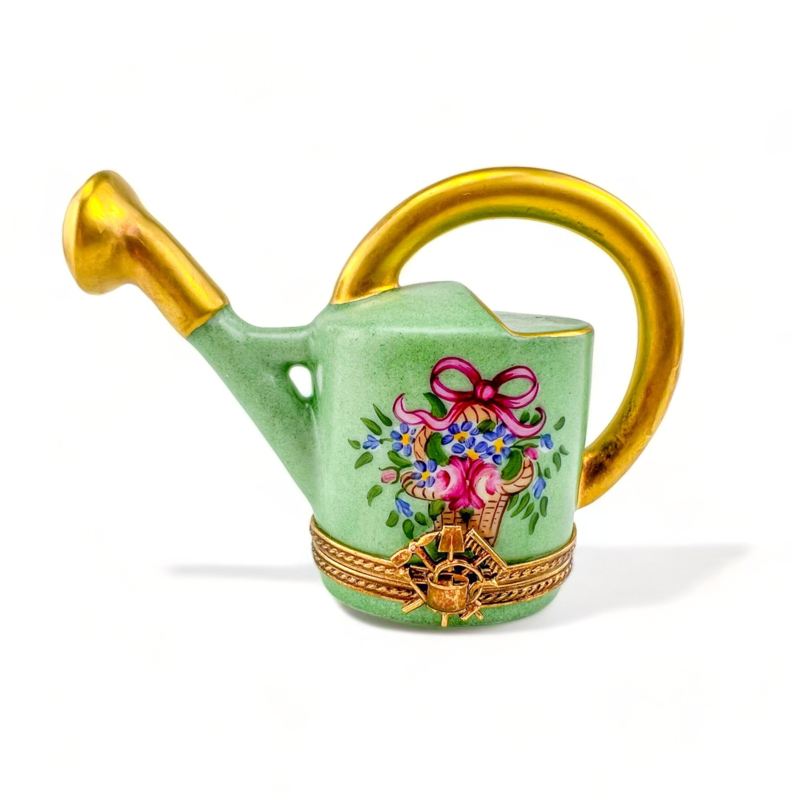 Limoges Peint Main Gardener's Watering Can Trinket Box: Hand painted in a pleasing Green with gilt and floral detail. Measures: 3 1/2" W x 1 3/4" D x 2 1/4" H