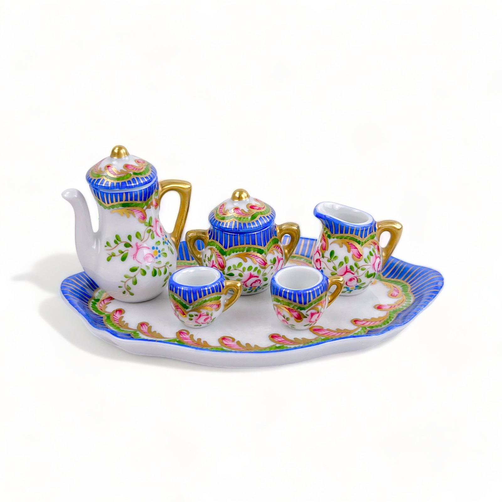 Limoges Tea or Coffee Service on Tray: Coffee or tea time! Hand painted with floral motif, and gold accents. Measures 5" W x 3" D x 2" H