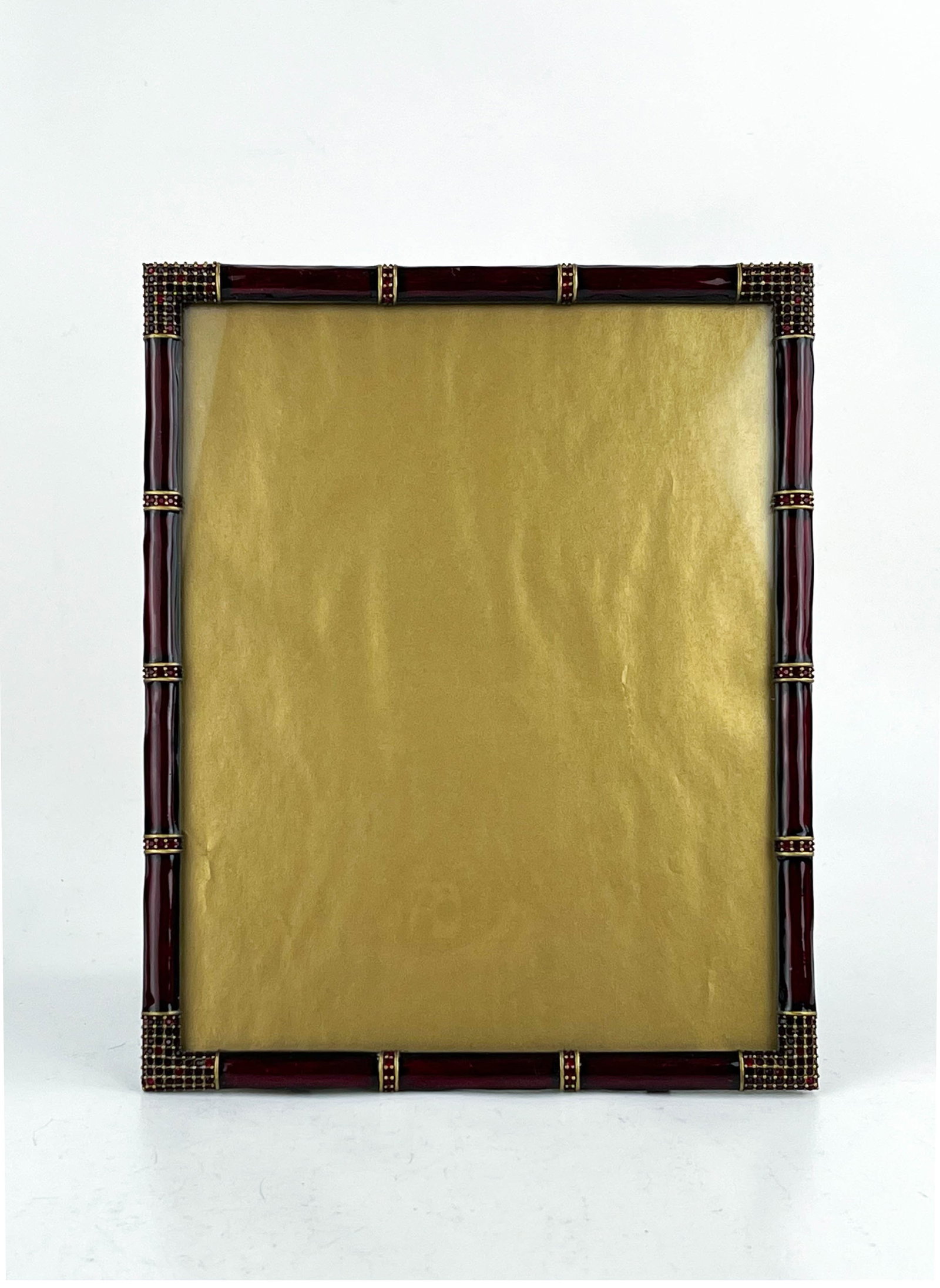 Jay Strongwater Gold and Deep Maroon Frame with Ruby Swarovski Crystals: Bamboo Motif Swarovski crystals in deep ruby color. Measures 8 1/2" W x 1/2" D x 10 3/4" H