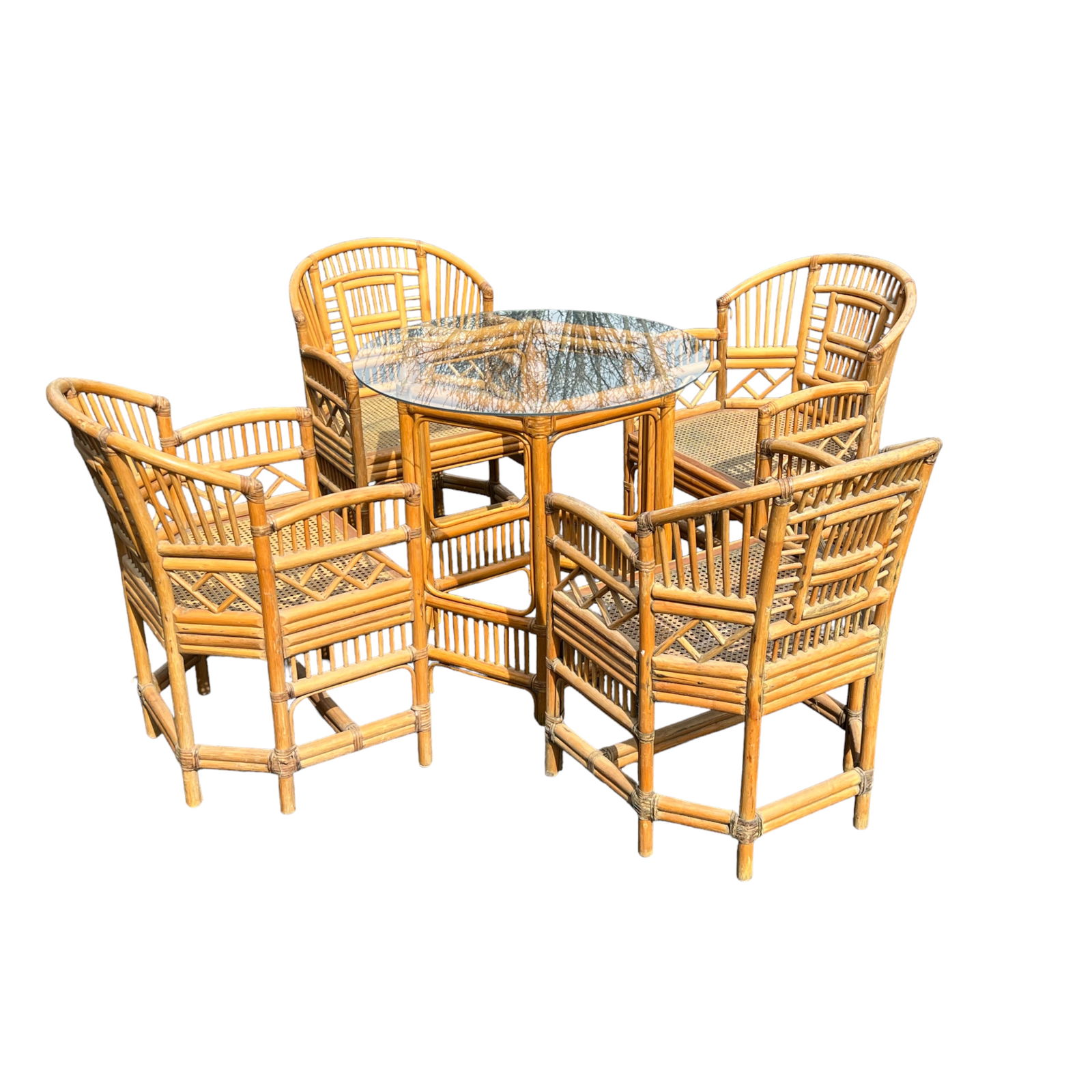 Vintage Hollywood Regency Pavilion Style Rattan Bamboo Set: Late 20th Century Pavilion Style Rattan Bamboo Dining Set of Four Chairs and Matching Table with Glass Top. Note, small chip on glass. Measures: Each Chair 21 1/2" W x 17 1/2" D x 32" H Table 26" Dia