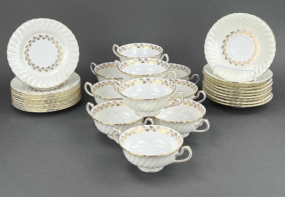 Vintage Minton, Gold Cheviot Bone China Tableware: Dessert Plate, Cups and Saucers. 30 pieces. 10 setttings. Cheviot Gold by Minton Bone China, Made in England. Measures: 10 Soup Cups 6 1/4" W x 4 1/2" D x 2 1/4" H 10 Saucers 6 1/4" Dia x 1" H 10 Brea