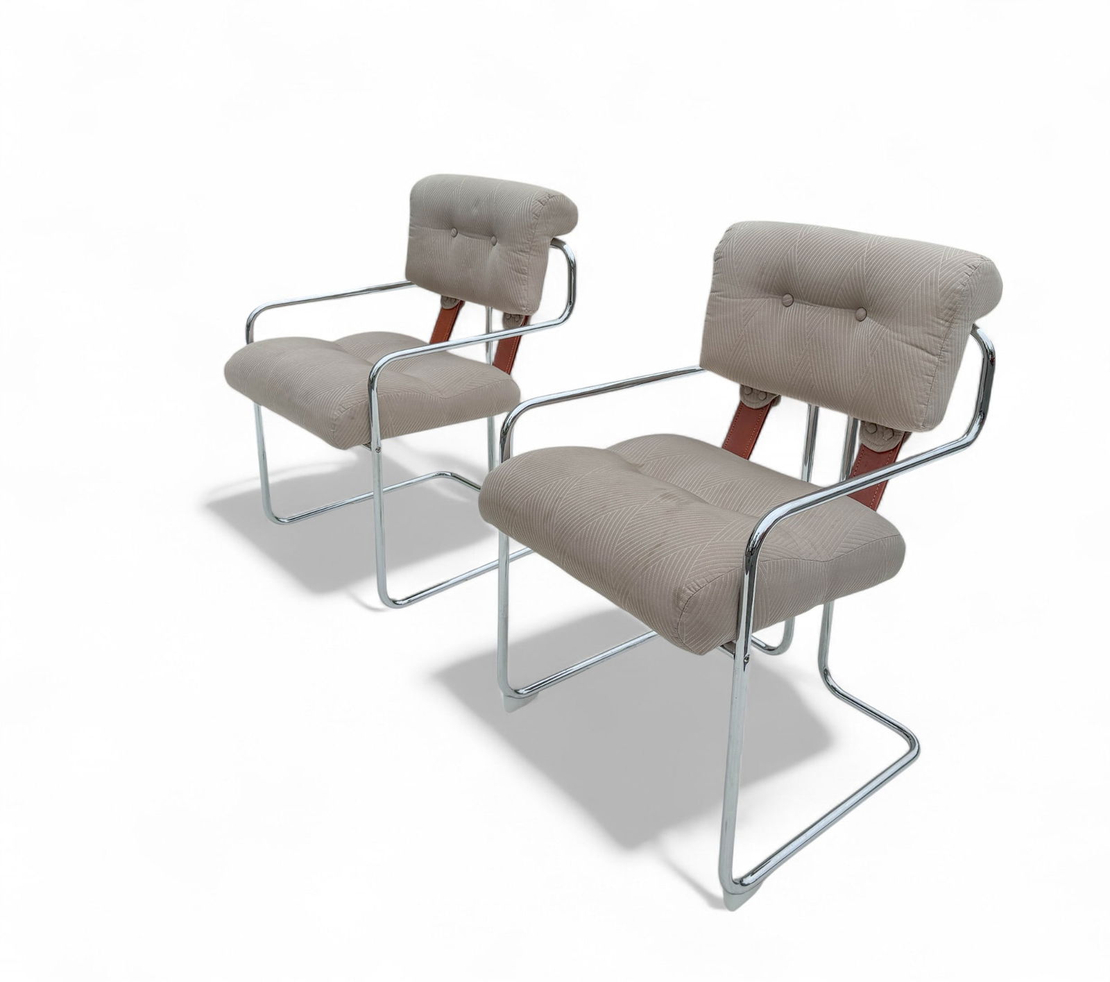 Guido Faleschini for Mariani Tucroma Chairs, Pair: Mid Century Modern Design with Leather strapping connects the back and seat rests with a beige upholstery set upon chrome legs. Measures 20 3/4 "W x 25 3/4" D x 33 1/4" H Upholstery could stand for a