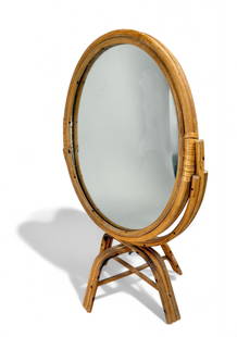 Vintage Rattan Table Top Mirror: Hollywood Regency gone Boho Chic... Oval Shaped, bent rattan frame with mirror set on hinged feet. Measures 15" H x 10 "W