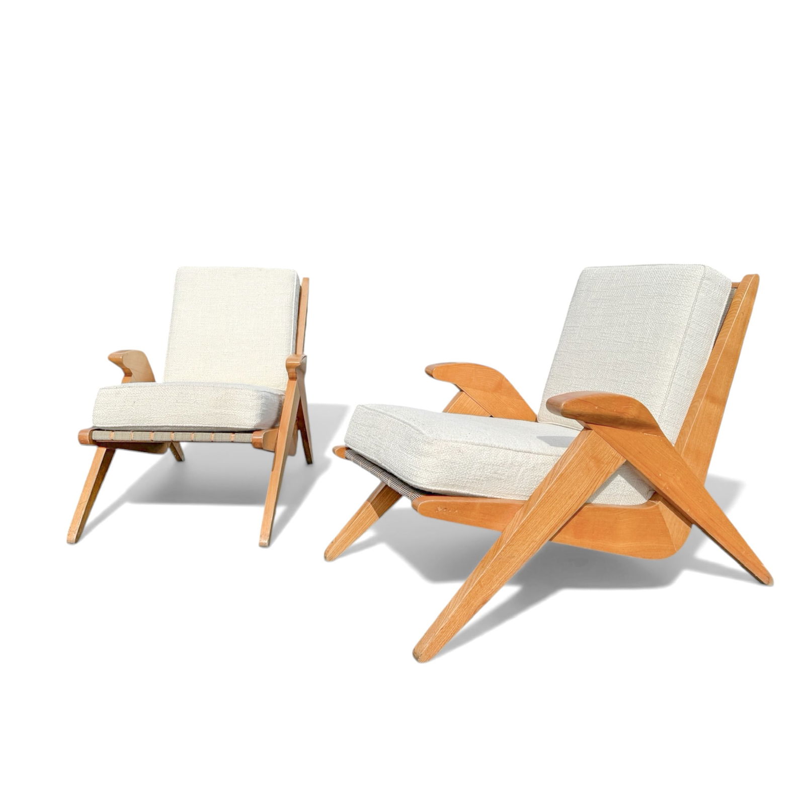 Pair, Mid Century Cats Cradle French Arm Chairs: Pair, Mid Century Modern, cats cradle arm chairs made of oak wood with white boucle cushions. Each Chair Measures 22 3/4" W x 38 1/2" D x 30" H