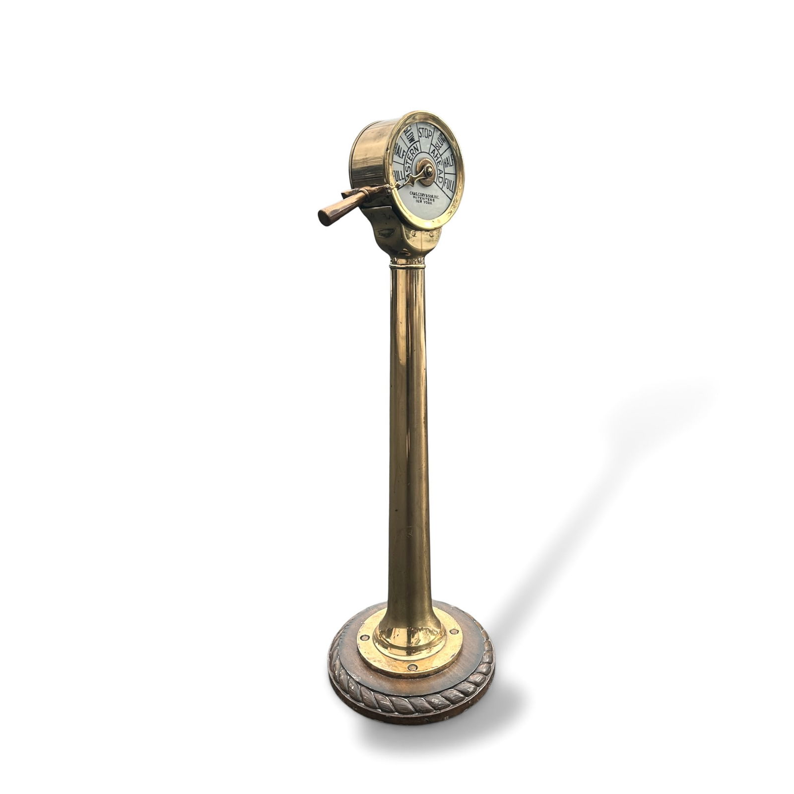 Ships Engine Order Telegraph in Brass from Charles Cory & Son: Vintage or Antique Ships Engine Order Telegraph in Brass with a wooden base. Manufactured by Charles Cory & Son, New York. Historically used for communication between the ship's bridge and the engine