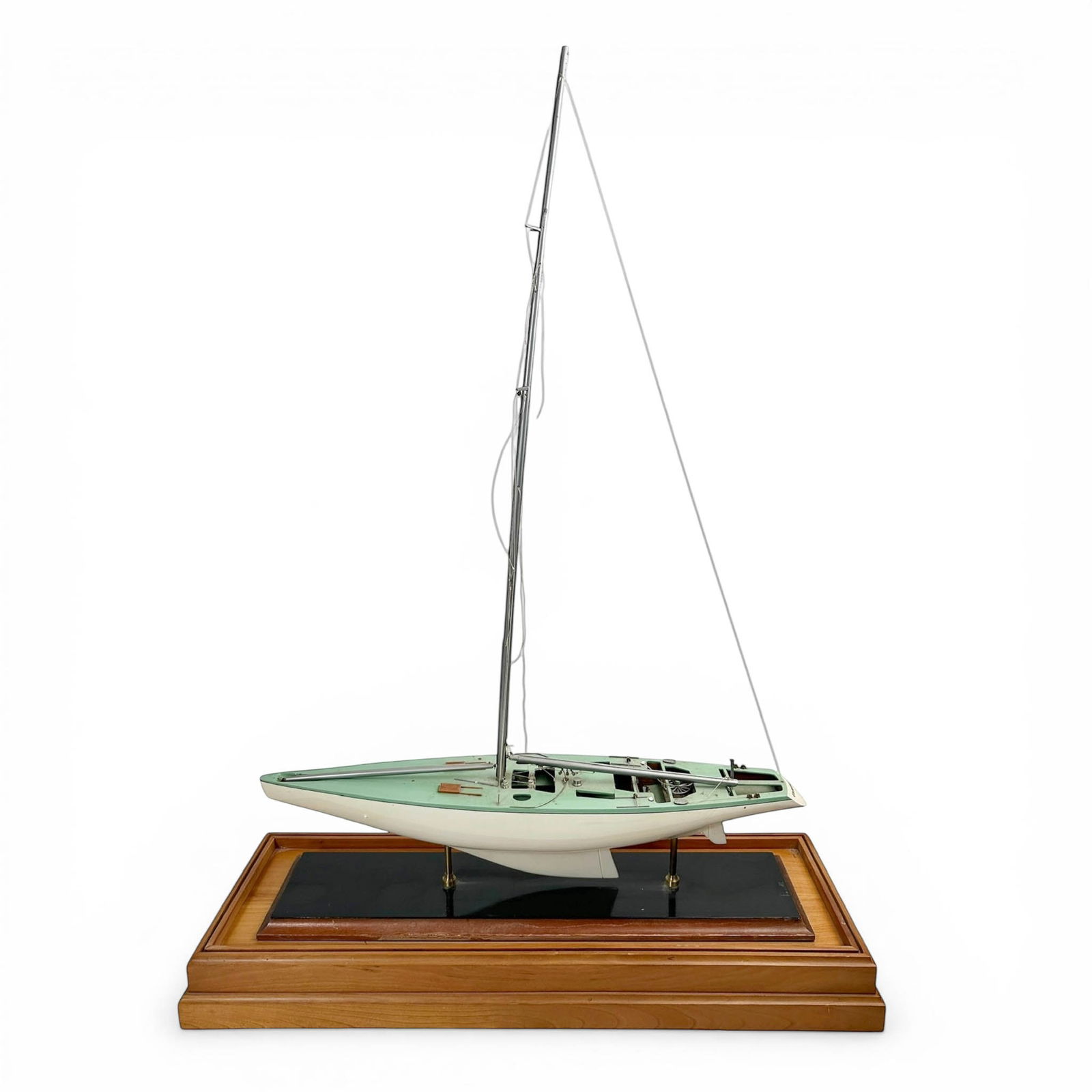 Corageous, Wooden Model Racing Yacht on Stand: Wooden Model boat of Ted Turner's Racing Yacht "Corageous". Pert and painted in celeste green on solid wood and lacquered base. Measures 24" W x 10" D x 38" H