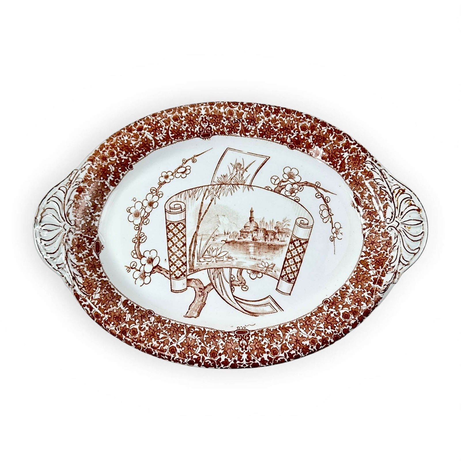 W.T. Copeland Staffordsire Transferware, Cairo, Serving Plater: Staffordshire manufacturer William T. Copeland & Sons, transferware serving platter in a light chocolate brown on white background. This Japanese and Egyptian Revival Motif pattern was in production f