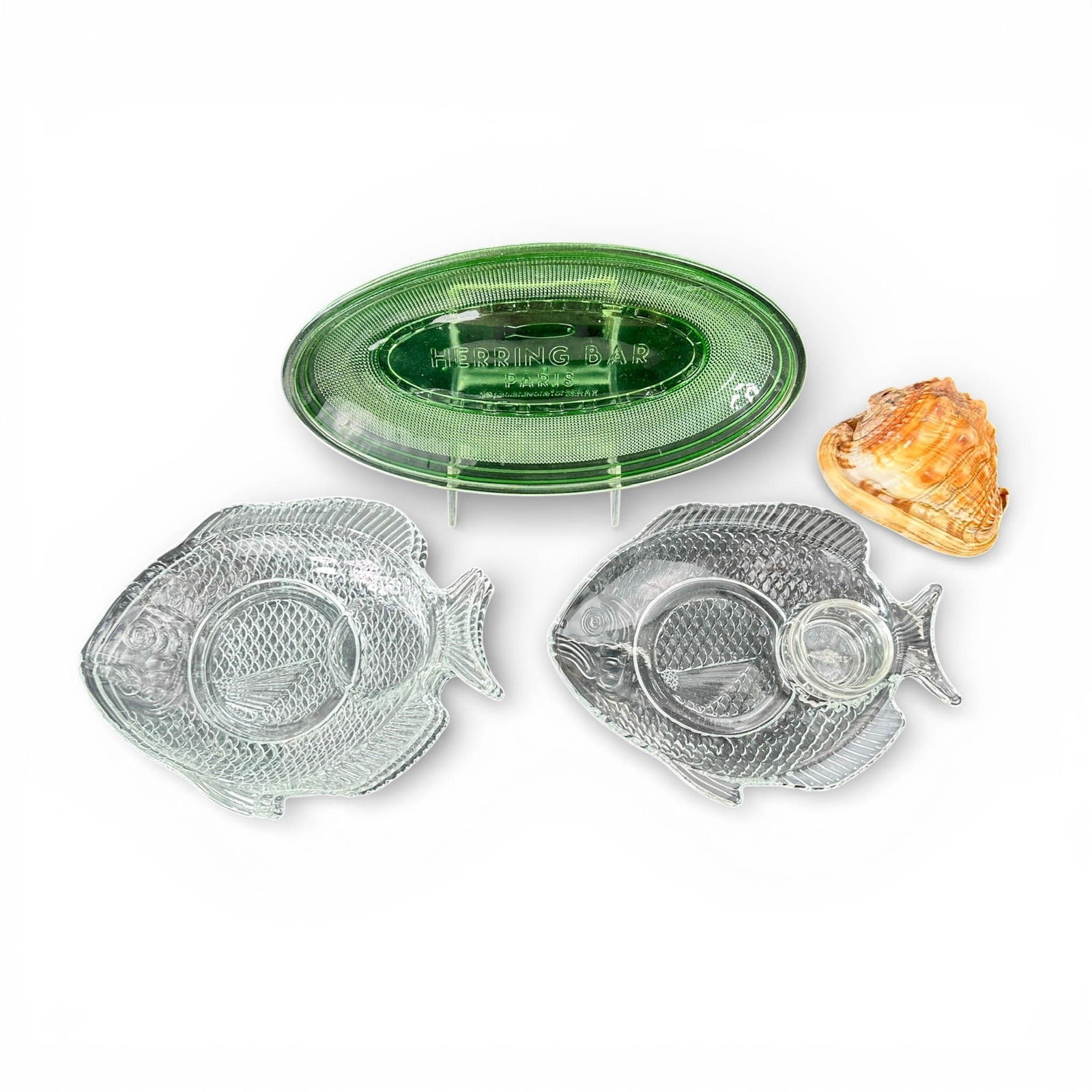 Herring Bar Paris, Green Glass Plate and Fish Plates: Vintage French Green Glass Herring Fish Plate and Clear Glass FIsh Plate serving dishes. Please refer to the following address for the pick-up location: 2 Quogue Plaza Trail, Quogue, NY 12105