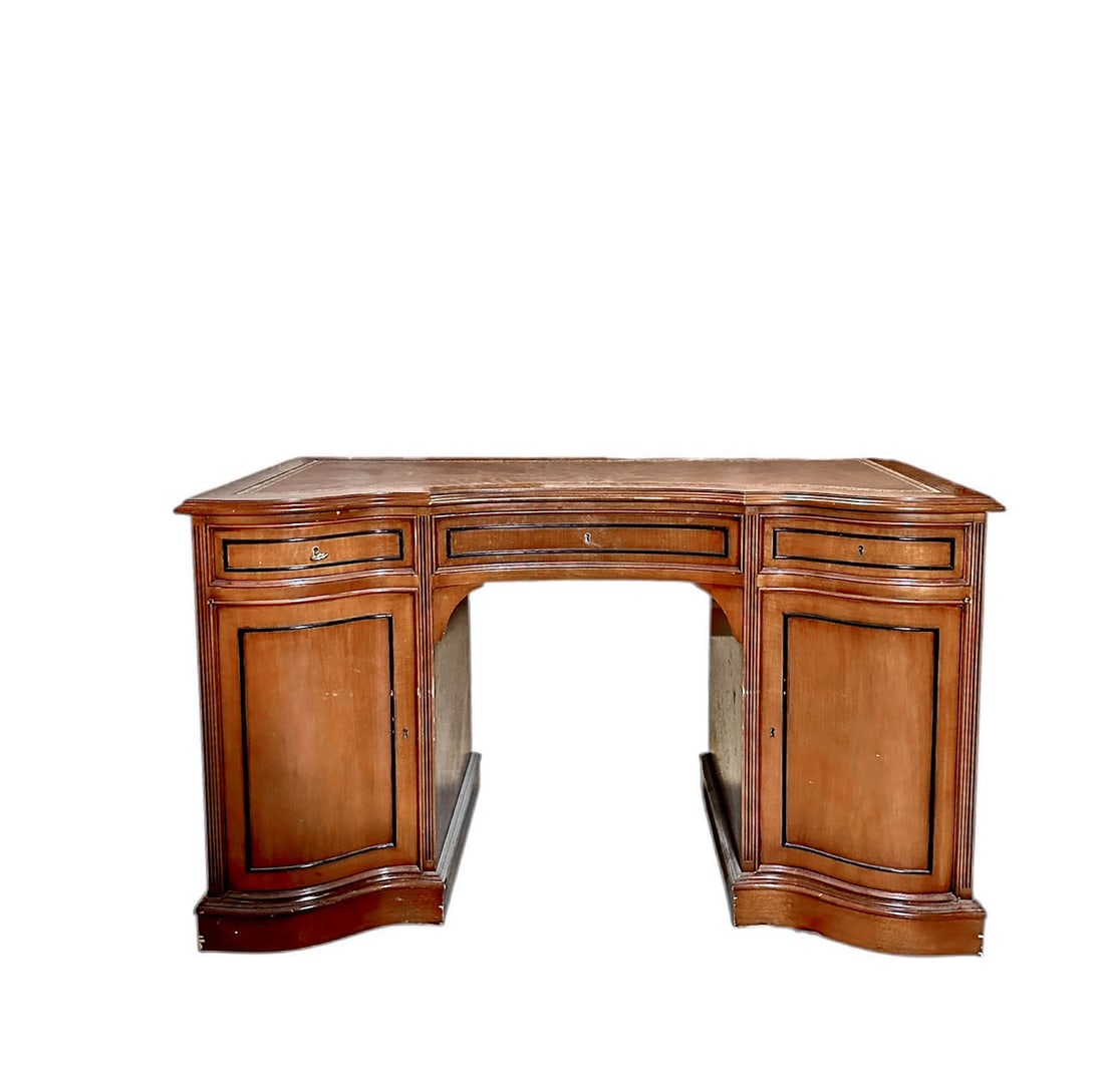 Bow Front Leather Top Pedestal Desk: Vintage Bow or serpentine front, pedestal desk with door and drawers for storage and a brown red leather top with gilt tooling. Please refer to the following address for the pick-up location: 2