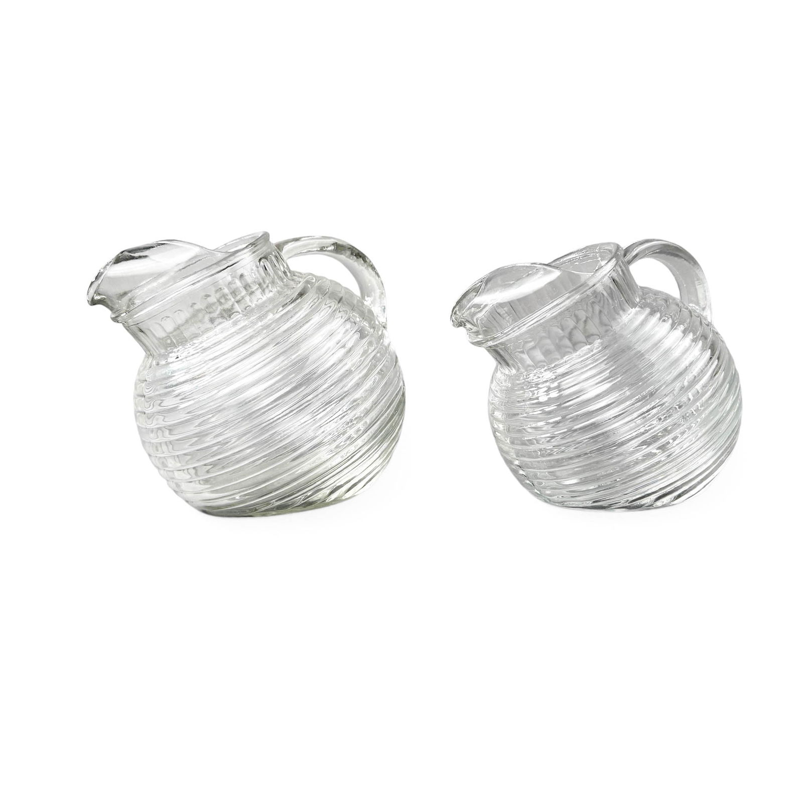 Anchor Hocking Manhattan Deco Glassware Pitchers, 2 pcs: Larger Measures 8 1/2' W x 7" D x 6 1/2" H 6 3/4" W x 6" D x 5 3/4" H Please refer to the following address for the pick-up location: 2 Quogue Plaza Trail, Quogue, NY 12133