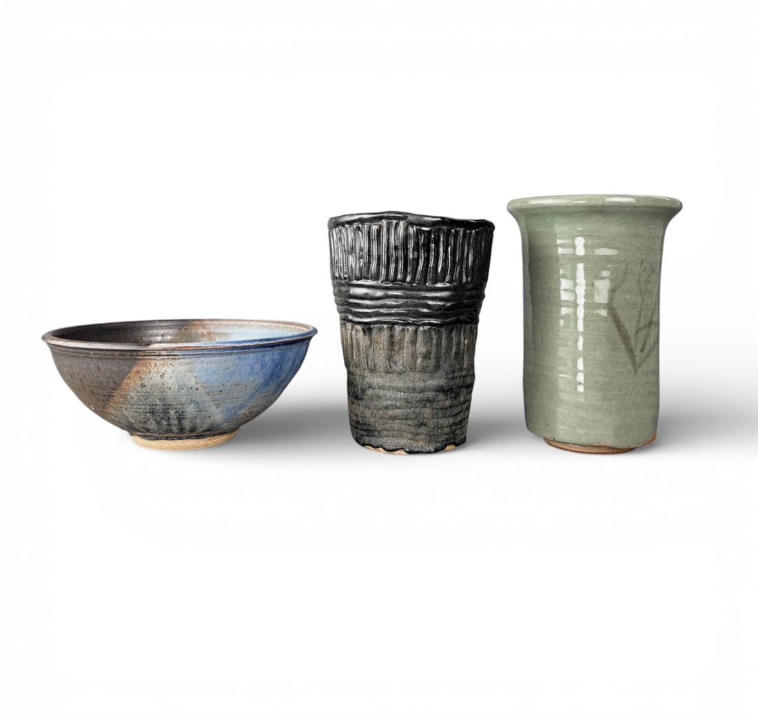 Vintage Ceramic Studio Pottery Vases: Two vintage pieces of hand made studio pottery vases. Celadon Green wheel thrown vase with asian styel desing and a Black glaze, hand built coil vase. Both Signed on bottom. Black Vase Measures Please